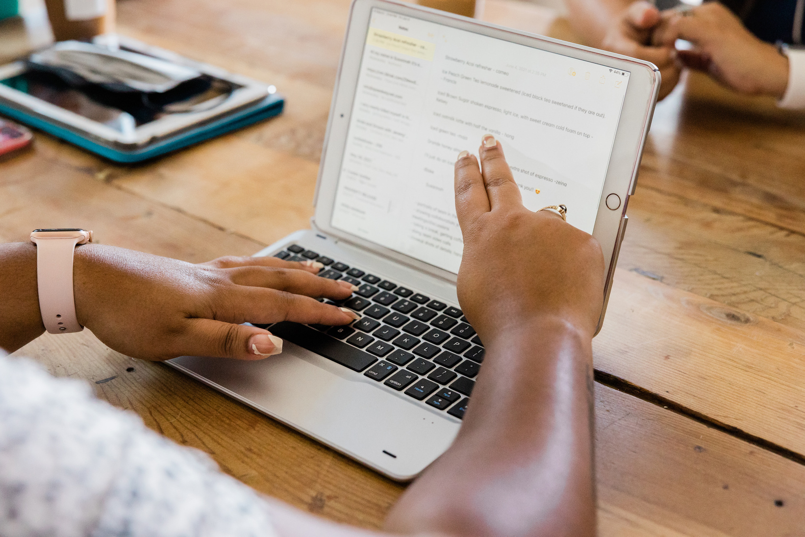 Woman Looking at Company Data on a Laptop